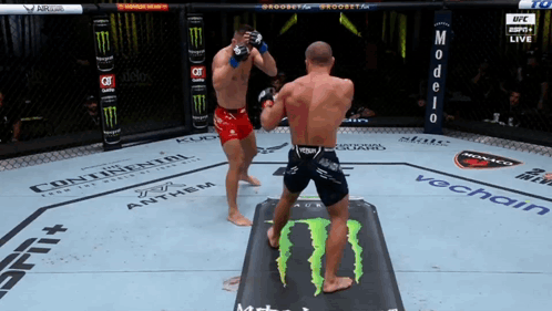 Two Men Fighting in Boxing Ring Monster Energy