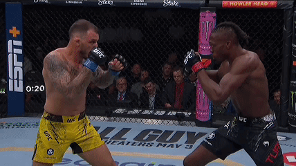 Two Men Fighting In Boxing Ring One Wearing UFC Shorts GIF