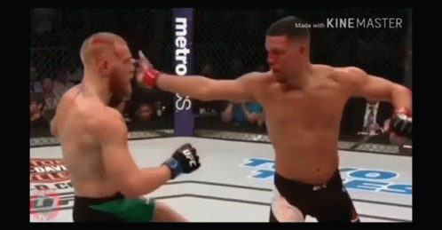Two Men Fighting in Boxing Ring