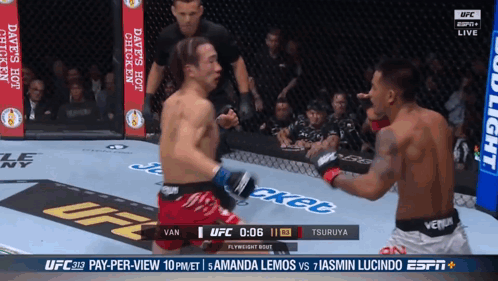Two Men Fighting in Boxing Ring