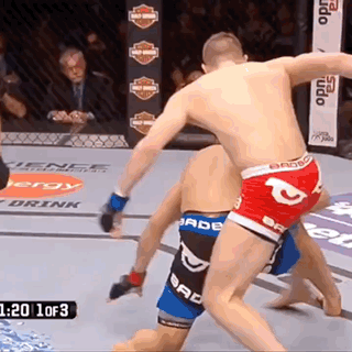 Two Men Fighting In Boxing Ring With Bad Boy Shorts GIF