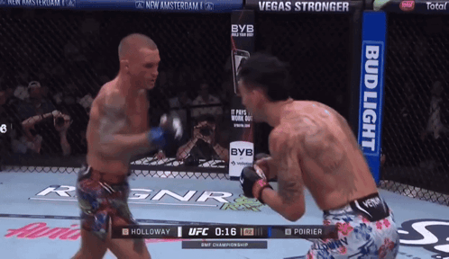Two Men Fighting in Boxing Ring With Bud Light Ad