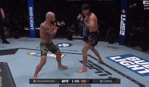 Two Men Fighting in Boxing Ring with Bud Light