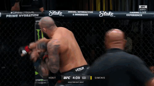Two Men Fighting In Boxing Ring With Budweiser And Easypost Ads GIF