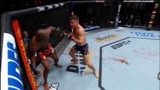 Two Men Fighting In Boxing Ring With ESPN Ad GIF