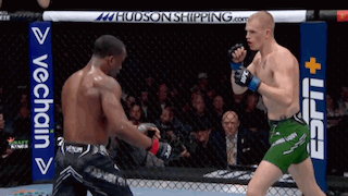 Two Men Fighting In Boxing Ring With ESPN Sign GIF