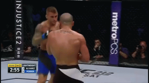 Two Men Fighting in Boxing Ring With MetroPCS Banner