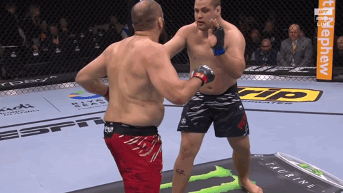 Two Men Fighting In Boxing Ring With Monster Energy Drink GIF