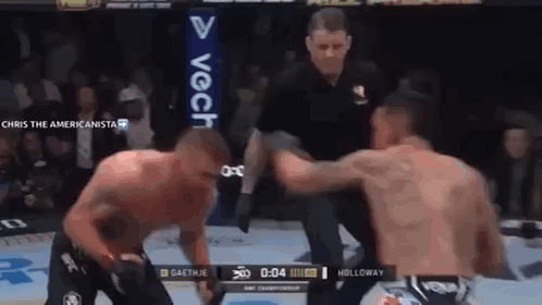 Two Men Fighting In Boxing Ring With Referee GIF