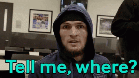 Two Men Fighting In Boxing Ring With UFC Shorts GIF