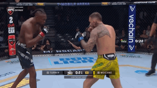 Two Men Fighting In Boxing Ring With VeChain Banner GIF