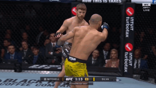 Two Men Fighting in Boxing Ring With Venum Belt