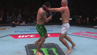 Two Men Fighting in Boxing Ring