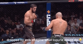 Two Men Fighting In Cage Dropped By Volk Imagine What Topuria Would Do On Bottom GIF