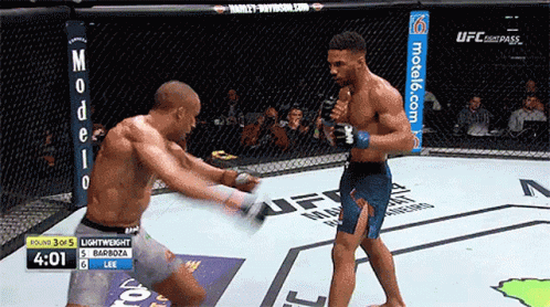 Two Men Fighting In Cage With Motel6.com GIF