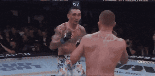 Two Men Fighting in Cage With Vegas Stronger
