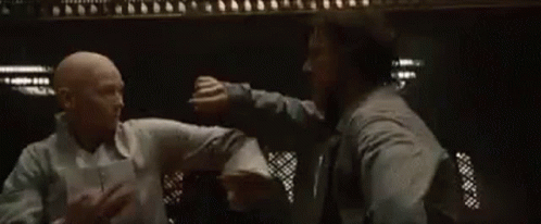 Two Men Fighting in Dark Room