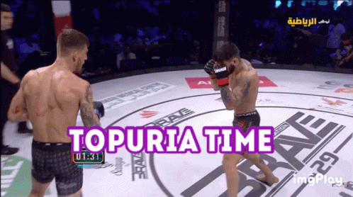 Two Men Fighting in Ring Topuria Time