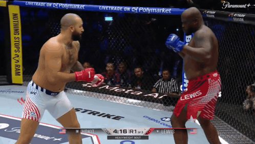 Two Men Fighting In Ring With Paramount Banner GIF