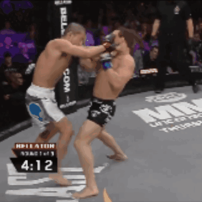 Two Men Fighting in Ring with Time 4:12
