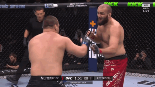 Two Men Fighting In UFC Ring, One In Red Shorts Saying Griev GIF