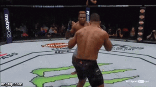 Two Men Fighting Monster on Ground
