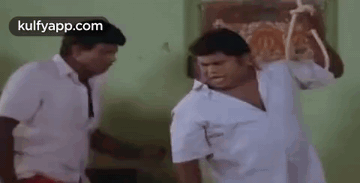 Two Men Fighting With Stick