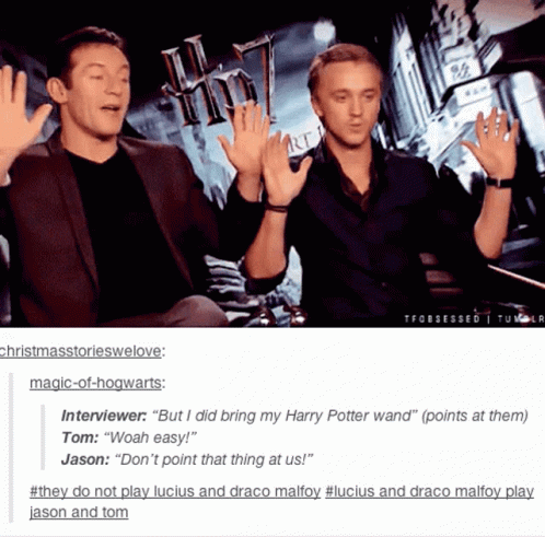 Two Men Giving Each Other High Fives With A Harry Potter Poster In The Background GIF