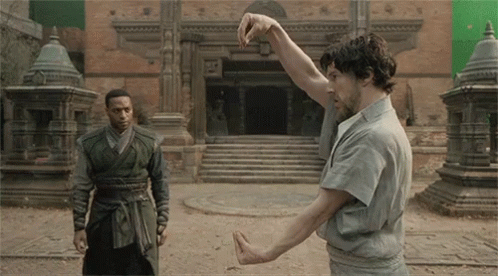 Two Men Hand Gesture Outside Building