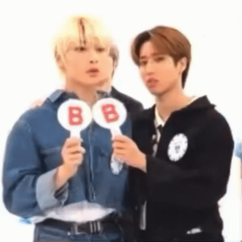 Two Men Holding B Signs