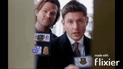 two men holding badges with the number 8 on it