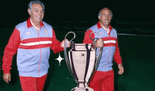Two Men Holding Champions League Trophy