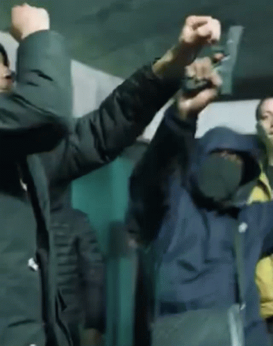 Two Men Holding Guns Right and Left