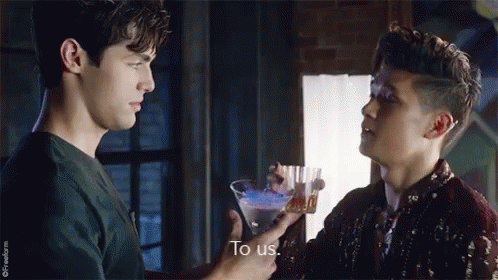 Two Men Holding Martini Glass Talking