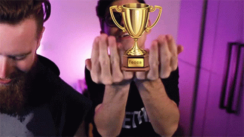 Two Men Holding Tessa Trophy GIF