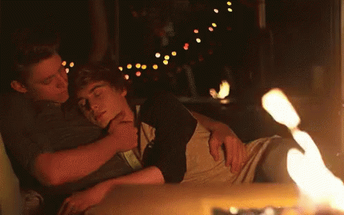 Two Men Hugging By Fireplace GIF