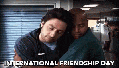Two Men Hugging Each Other In A Hospital With The Words International Friendship Day Below Them GIF