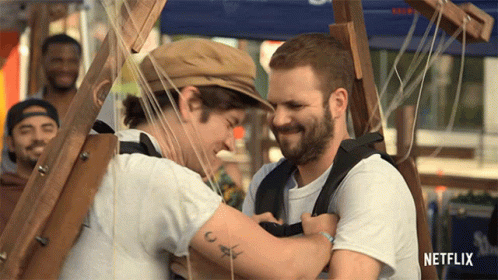 Two Men Hugging With Netflix Logo GIF