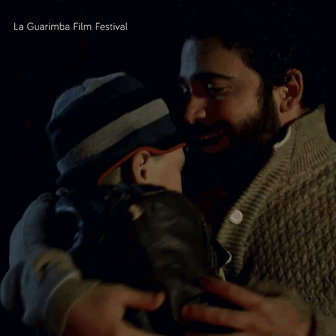 Two Men Hugging La Guarimba Film Festival GIF