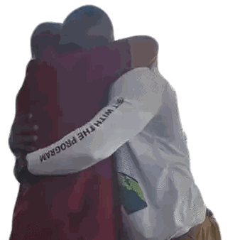 Two Men Hugging One Wearing I With The Program Shirt