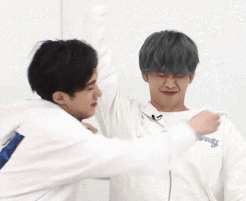 Two Men Hugging One Wearing New York Sweatshirt