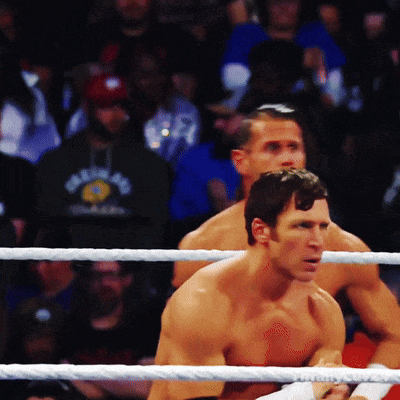 Two Men In A Boxing Ring With One Wearing A Shirt That Says ' New York ' GIF
