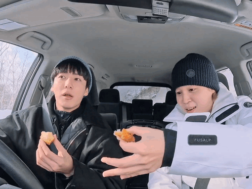 Two Men In A Car One Of Whom Is Wearing A Fusalp Jacket GIF