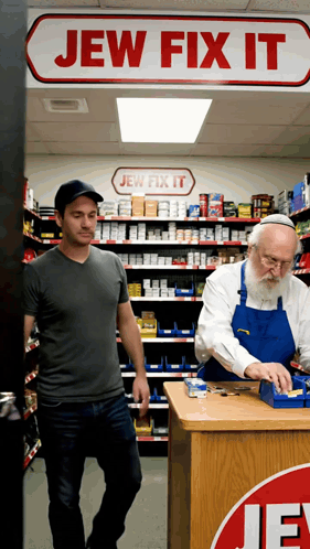 Two Men In A Jew Fix It Store With A Sign Above Them GIF