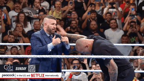 Two Men In A Wrestling Ring With Peacock In The U.s. And Netflix Internationally On The Bottom GIF