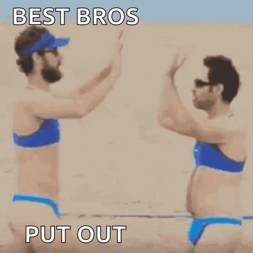 Two Women In Bikinis Holding Hands On Beach GIF