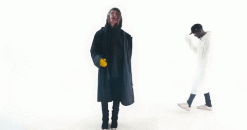 Two Men In Black And White Coats GIF