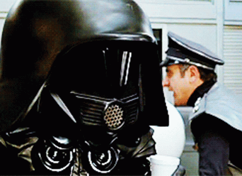 Two Men in Black Helmets