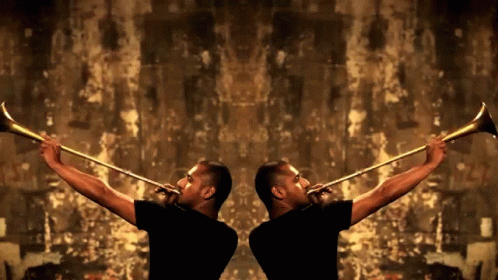 Two Men In Black Shirts Are Playing Trumpets In Front Of A Brown Wall GIF