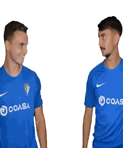 Two Men in Blue Shirts Pointing